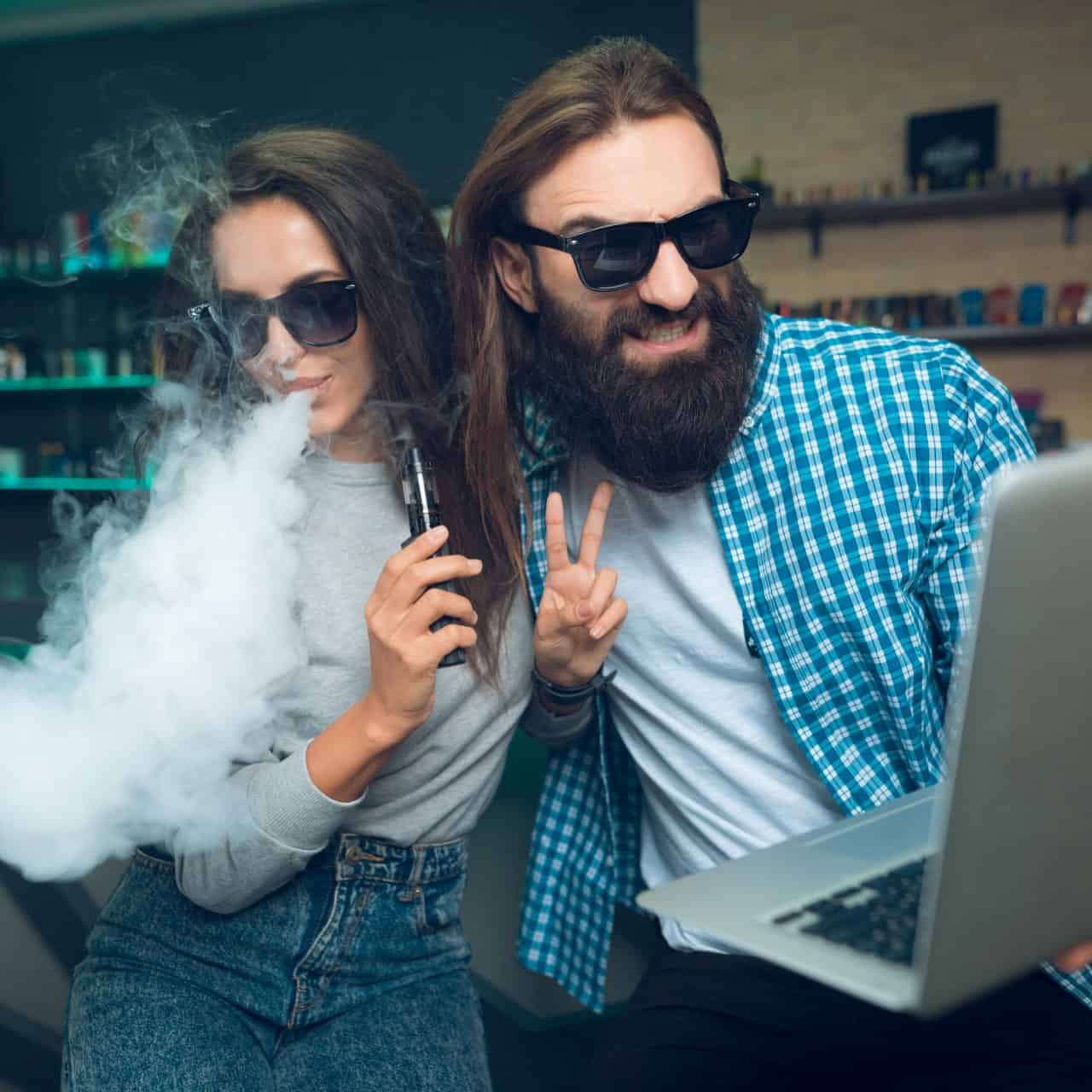 Vape enthusiasts vaping indoors at a vape shop.